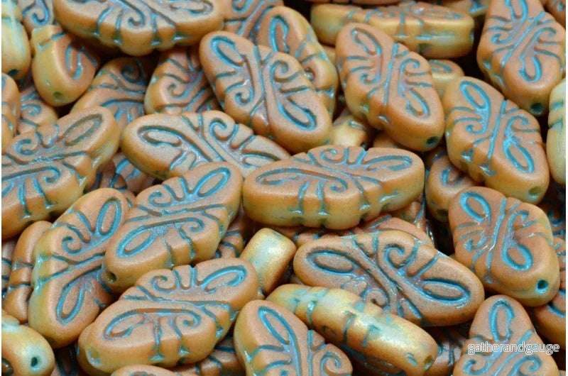Arabesque Beads – Matt Brown med Blue 19x9mm, 6-pack