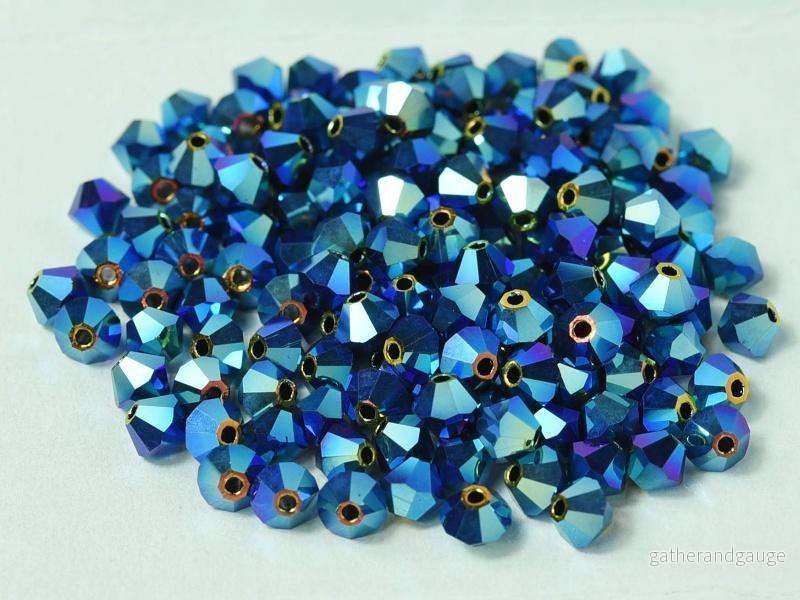 Tjeckiska Bicone – Garnet 2x AB, 4 mm, 24-pack Tjeckiska Bicone – Garnet 2x AB, 4 mm, 24-pack