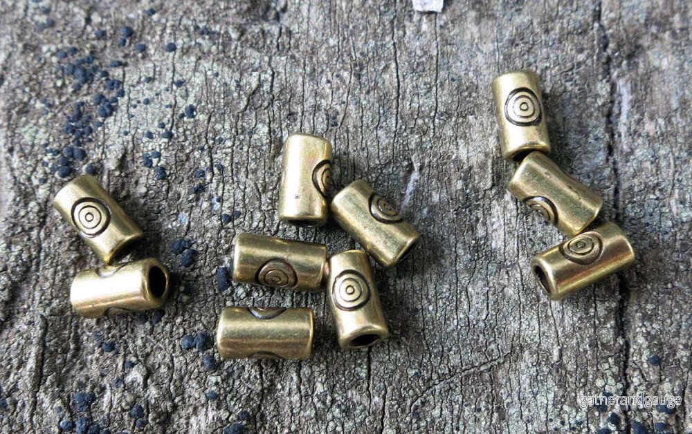 Mellandel Bronsfärgad - Tub med cirkel 3,2x5,7 mm, 10-pack