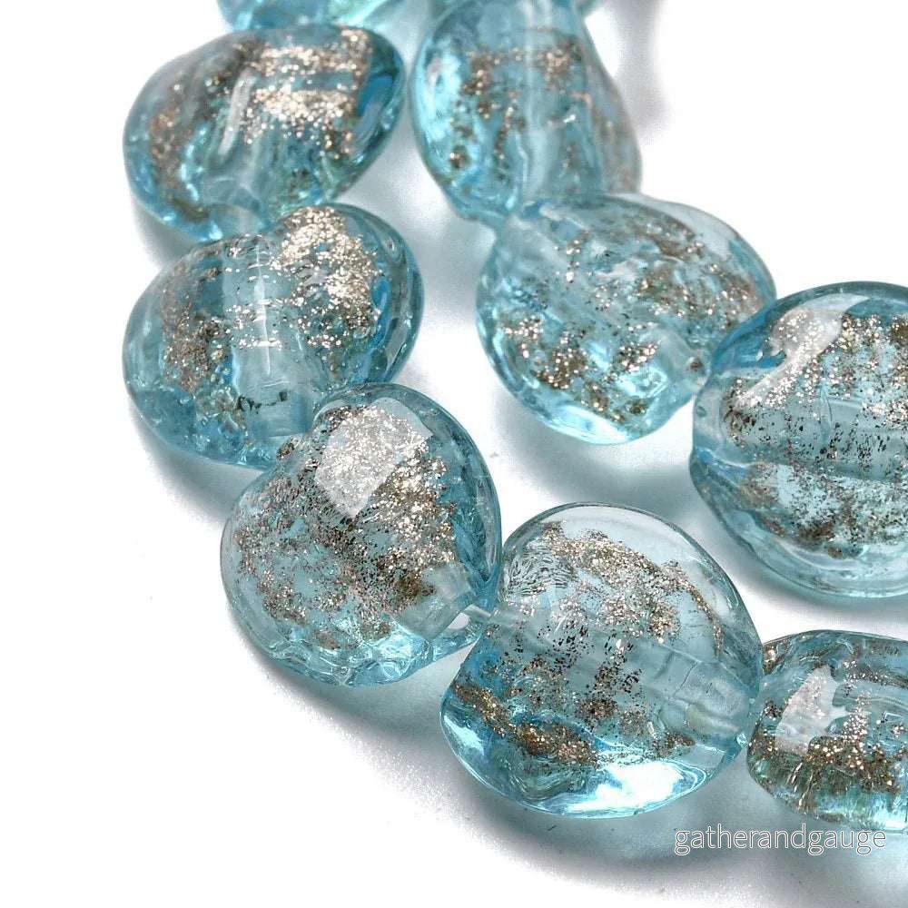 Lampwork Hjärta – Ljusblå med Guldglitter 12mm 1 styck Lampwork Hjärta – Ljusblå med Guldglitter 12mm 1 styck