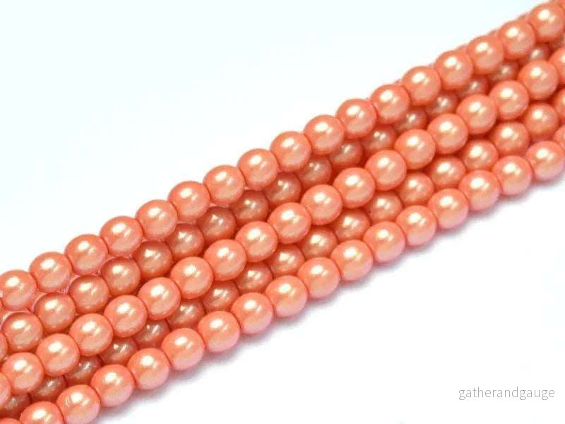 Tjeckiska Pearl Shell – Orange Sherbet 2mm, 1 sträng Tjeckiska Pearl Shell – Orange Sherbet 2mm, 1 sträng