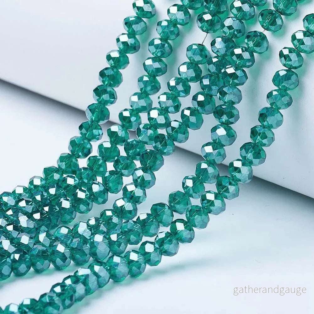 Facetterade glaspärlor – Dark Cyan Lyster 2,5x2mm 1 sträng