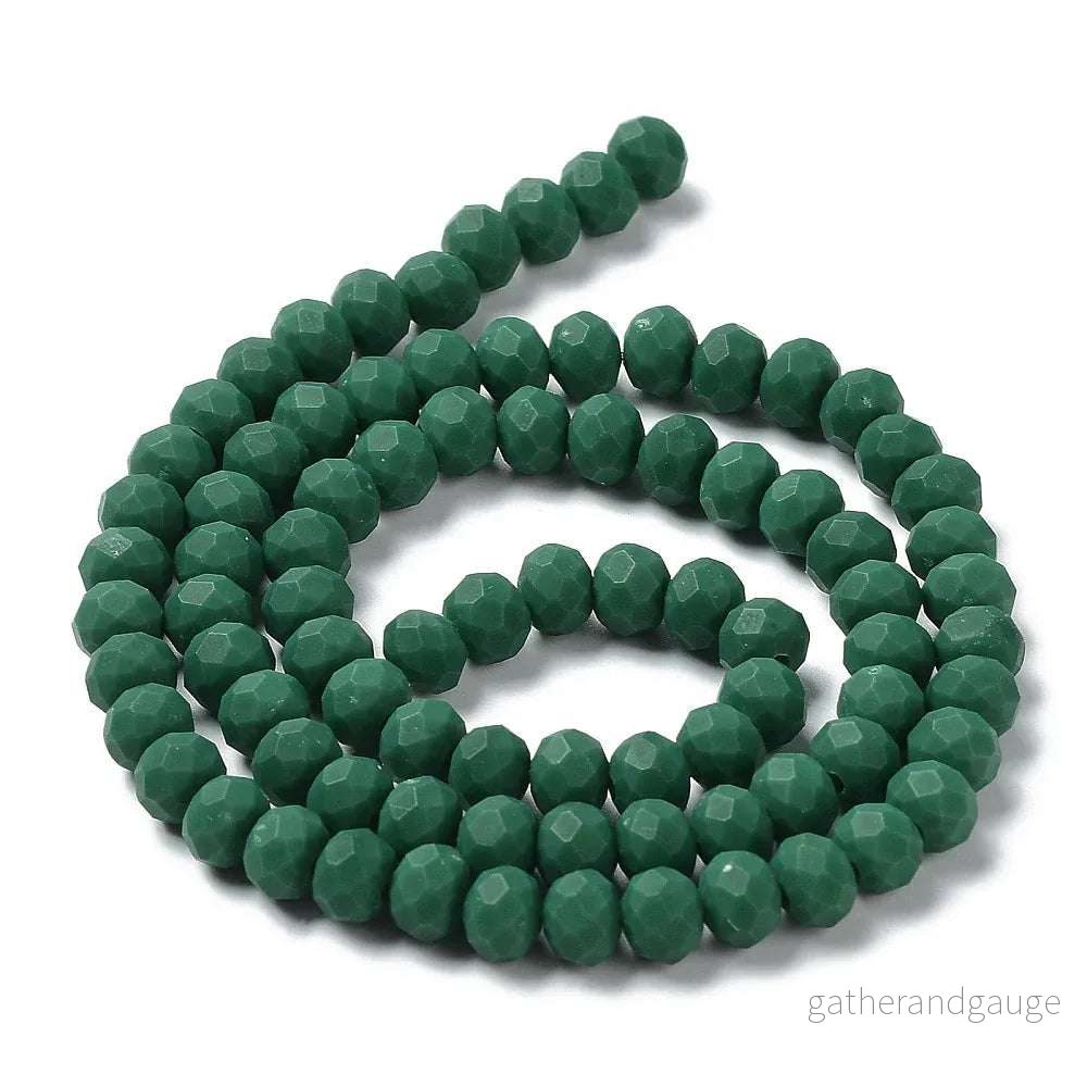 Facetterade glaspärlor - Matt Mörkgrön, 6x5mm 1 sträng - Bild 2