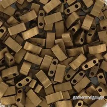 Miyuki Half Tila – Matte Metallic Gold 5×2,5mm, 5 gram Miyuki Half Tila – Matte Metallic Gold 5×2,5mm, 5 gram