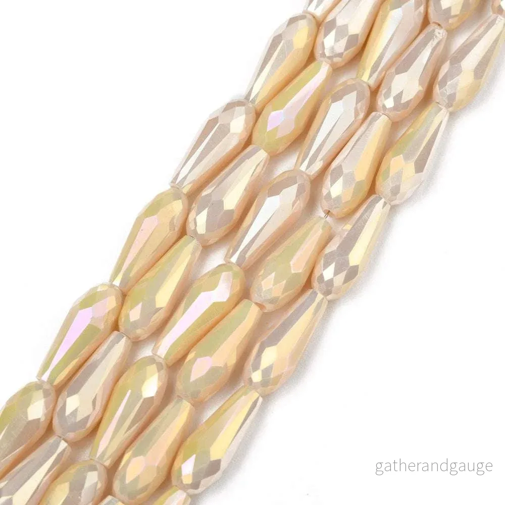 Facetterade droppar – Teardrop Wheat Rainbow, 15x6mm, 1 styck Facetterade droppar – Teardrop Wheat Rainbow, 15x6mm, 1 styck