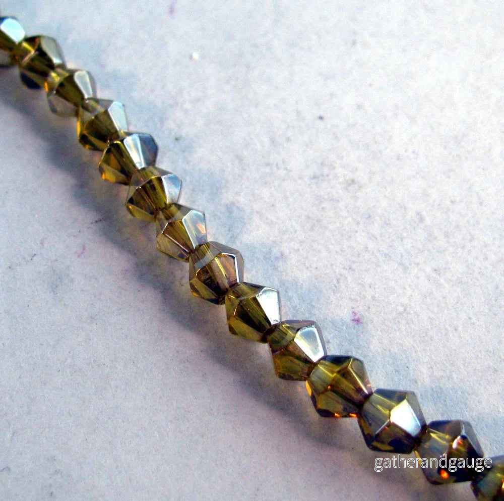 Glaspärlor Bicone - Guldgul med AB, 4mm, 1 sträng - Bild 2