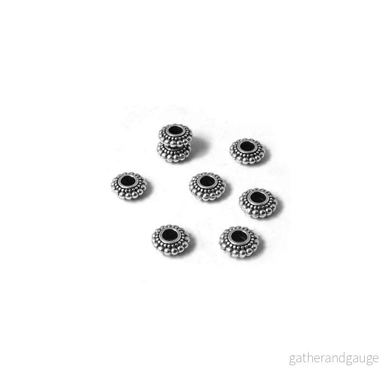 Mellandel silverpläterad - Rondell med prickar, 10-pack
