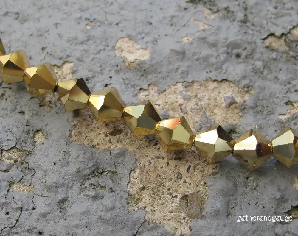 Tjeckiska MC Bicone - Crystal Aurum 6 mm, 18- pack - Bild 2