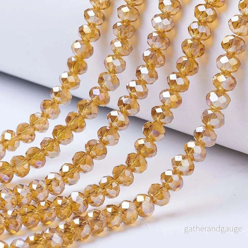Facetterade glaspärlor - Topaz AB 3x2mm 1 sträng