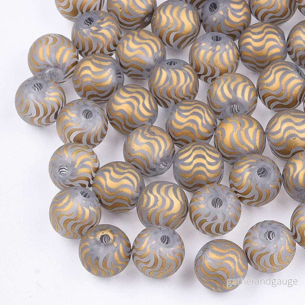 Glaspärla Rund - Randigt mönster Gold 8mm 1 styck - Bild 2