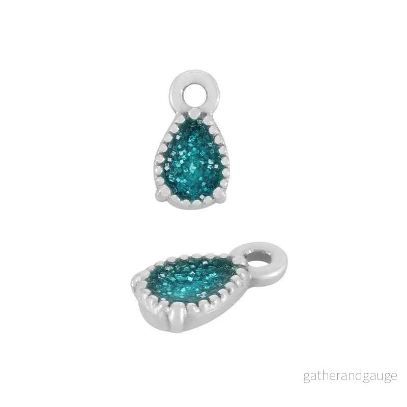 Berlock Silverpläterad – Droppe glitter turkos 1 styck Berlock Silverpläterad – Droppe glitter turkos 1 styck