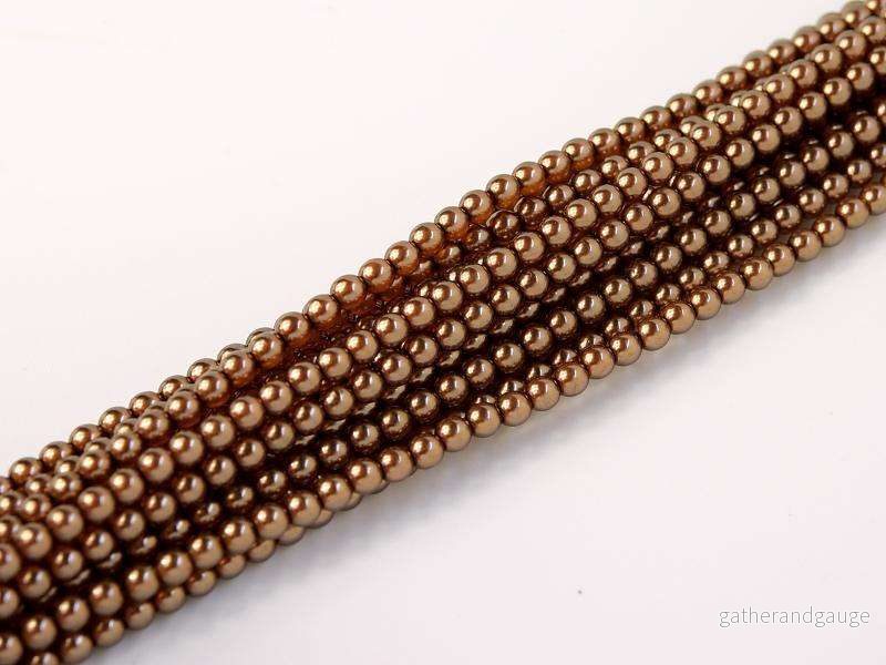 Tjeckiska vaxade glaspärlor - Crystal Brown 2mm, 1 sträng