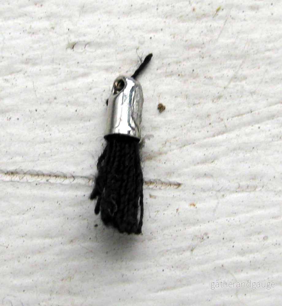 Bomullstofs Mini – Svart/Silver 12mm – 1 styck