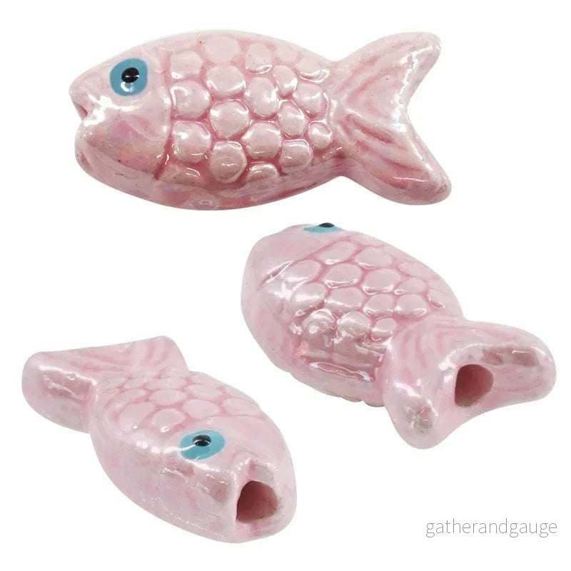 Porslinspärla – Fisk Rosa 26x12mm 1 styck Porslinspärla – Fisk Rosa 26x12mm 1 styck