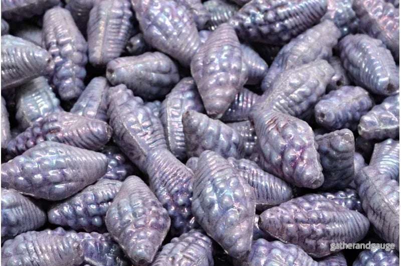 Miter Shell Beads – Chalk white lila nebula 16x8mm, 10-pack Miter Shell Beads – Chalk white lila nebula 16x8mm, 10-pack