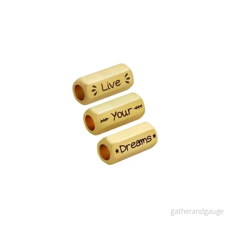 Mellandel Guldfärgad – Tub med text ”Live, Your, Dreams” 8x19mm Mellandel Guldfärgad – Tub med text ”Live, Your, Dreams” 8x19mm