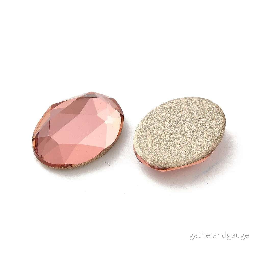 Facetterad Flatback – Oval Padparadscha 14x10mm 1 styck Facetterad Flatback – Oval Padparadscha 14x10mm 1 styck