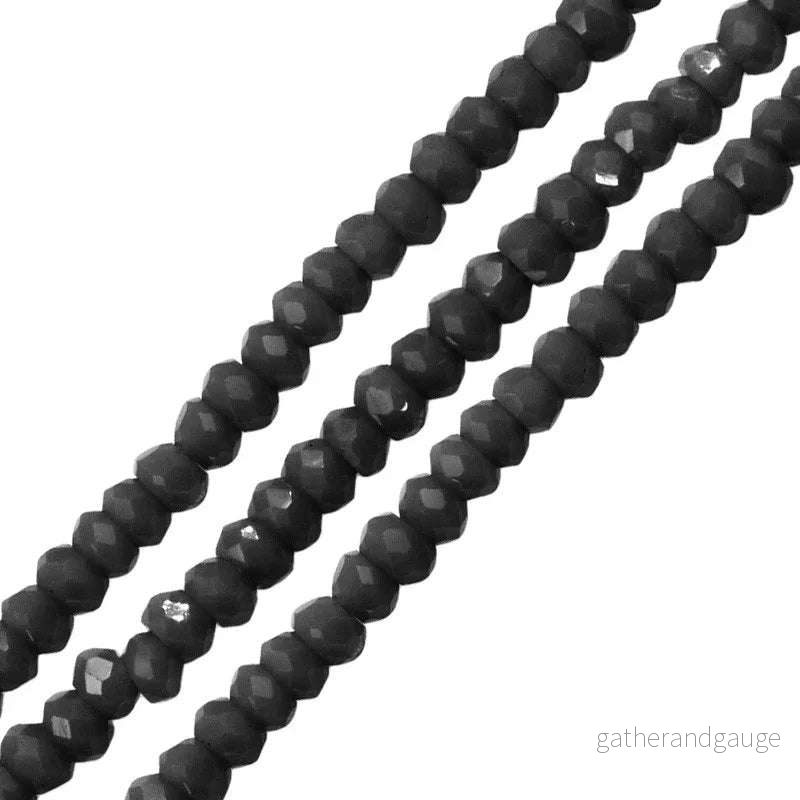 Facetterade glaspärlor - Svart 2,6x1,7mm 1 sträng