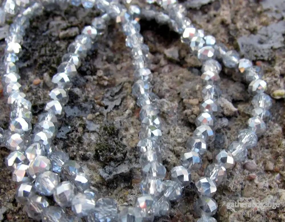Facetterade glaspärlor - Klar/Silver, 4x3mm, 1 sträng - Bild 2