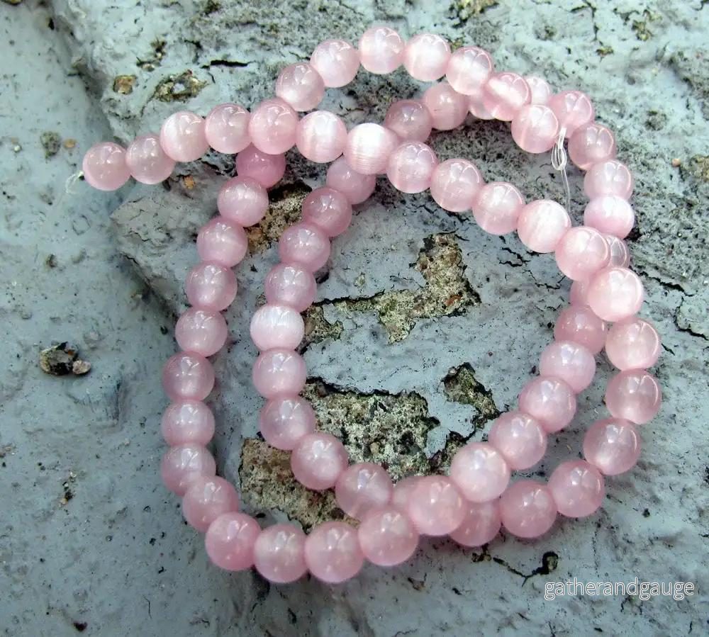 Cat’s eye pärlor – Rund Rosa 6mm, 1 sträng