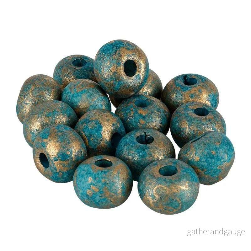 Porslinspärla – Rund Petrol med guldstänk 12mm 1 styck Porslinspärla – Rund Petrol med guldstänk 12mm 1 styck