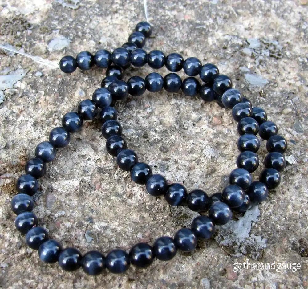 Cat’s eye pärlor – Rund Svart 6mm, 1 sträng