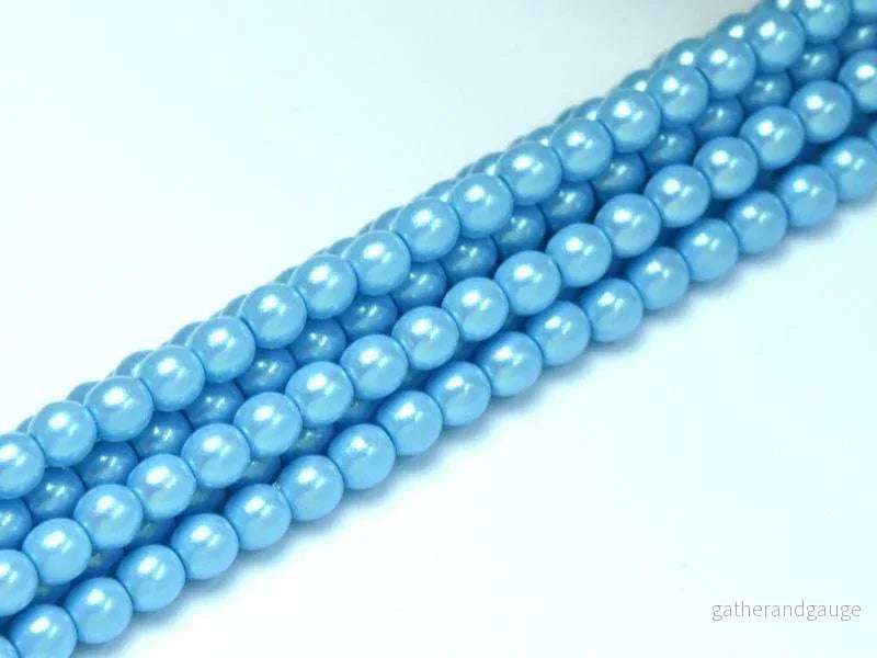Tjeckiska Pearl Shell - Nile Blue 2mm, 1 sträng