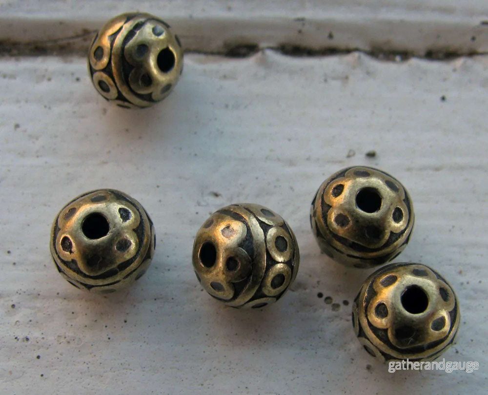 Mellandel bronsfärgad - Rund med cirklar 7mm 5-pack