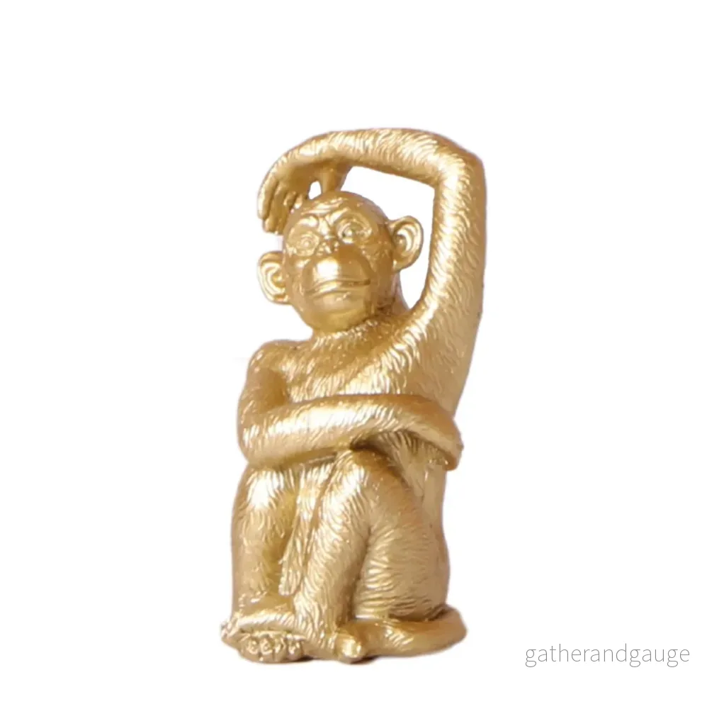 Guld sittande apa – dekorativ figur Guld sittande apa – dekorativ figur