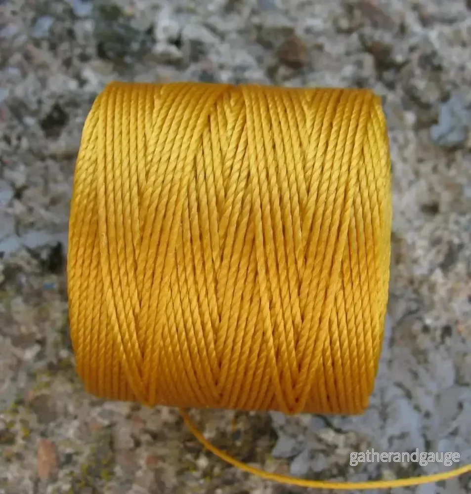 S- Lon bead cord – Light Gold, 1 rulle S- Lon bead cord – Light Gold, 1 rulle