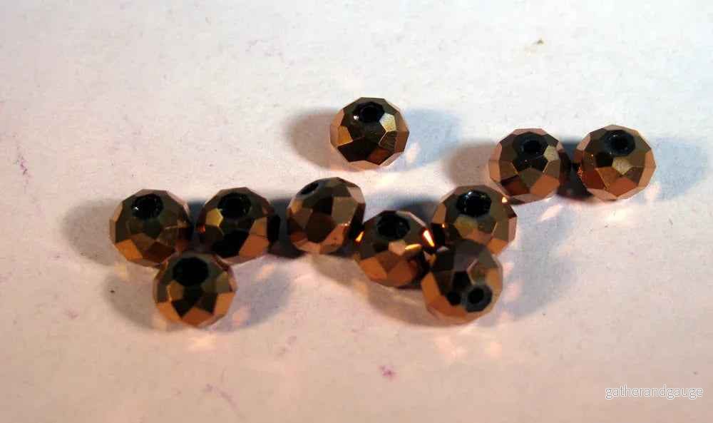 Facetterade glaspärlor - Elektropläterade koppar 6x4mm 1 sträng - Bild 2