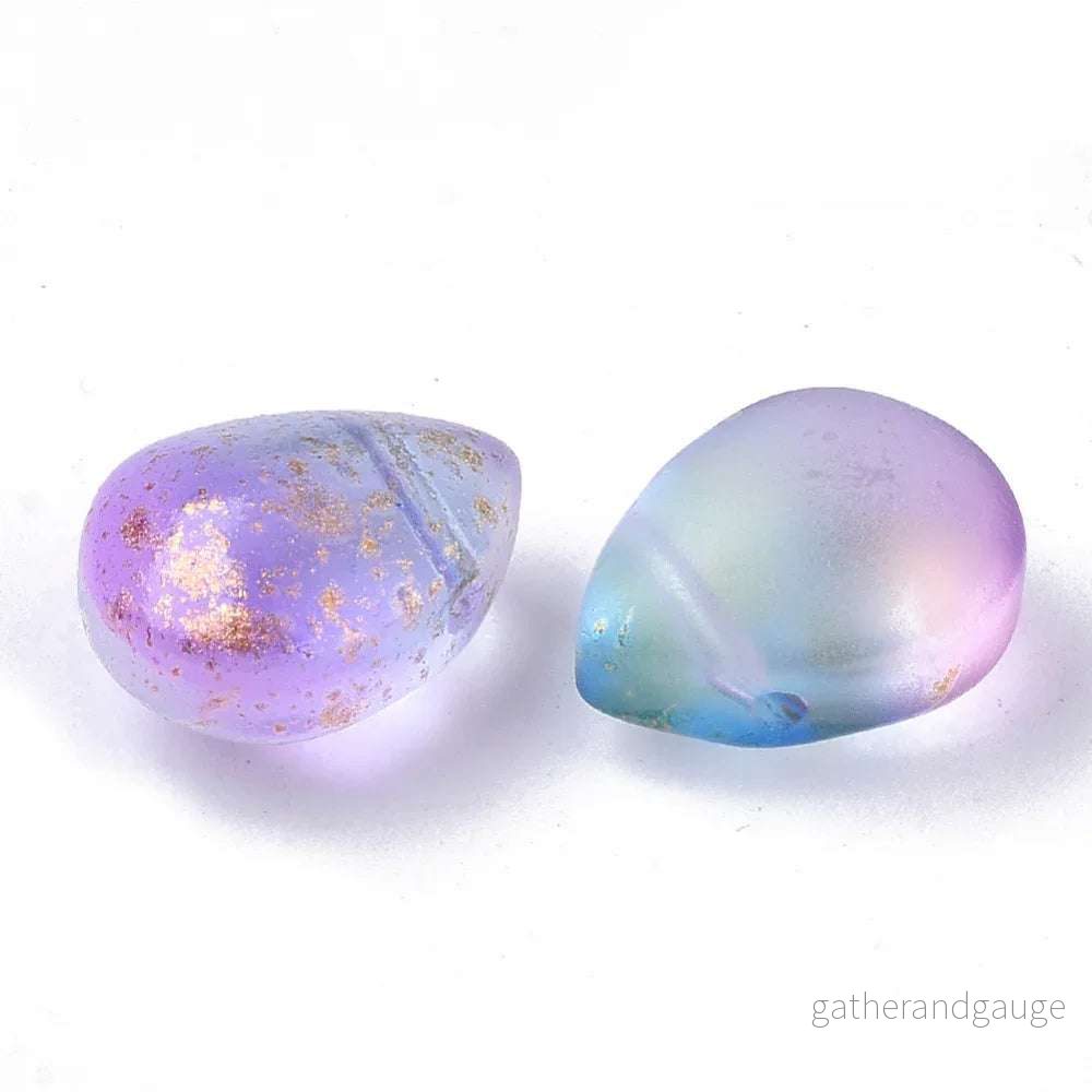 Droppe – Rosalila blå med guldglitter, 12,5×9,5mm