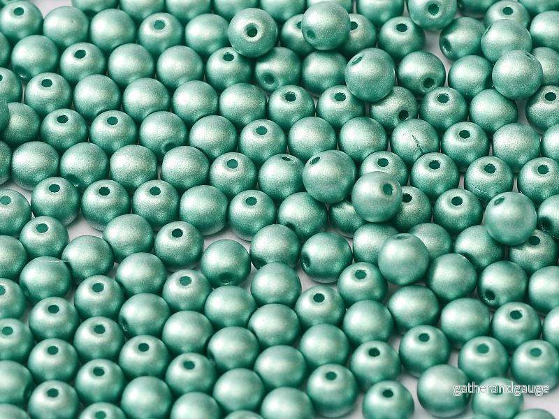 Tjeckiska Druks - Metallic Emerald 4 mm, 50-pack
