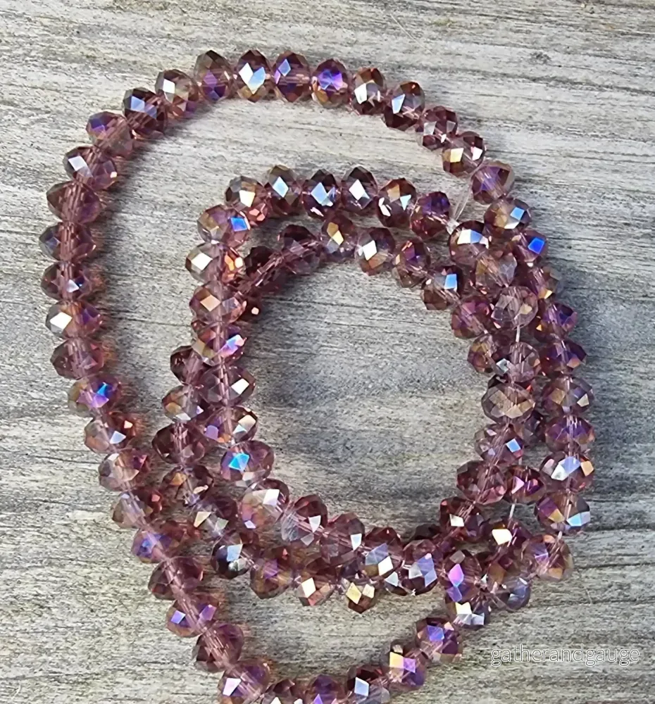 Facetterade glaspärlor – Amethyst med AB-lyster, 6x4mm 1 sträng