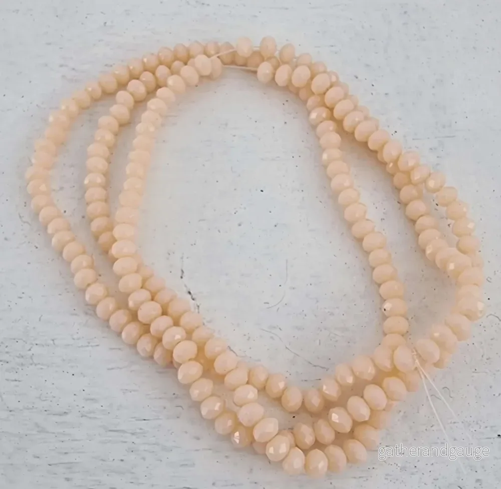 Facetterade glaspärlor - Beige, 3x2mm, 1 sträng