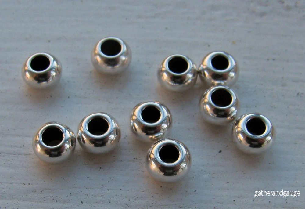Mellandel Silverfärgad – Rund 6×4 mm, 10-pack