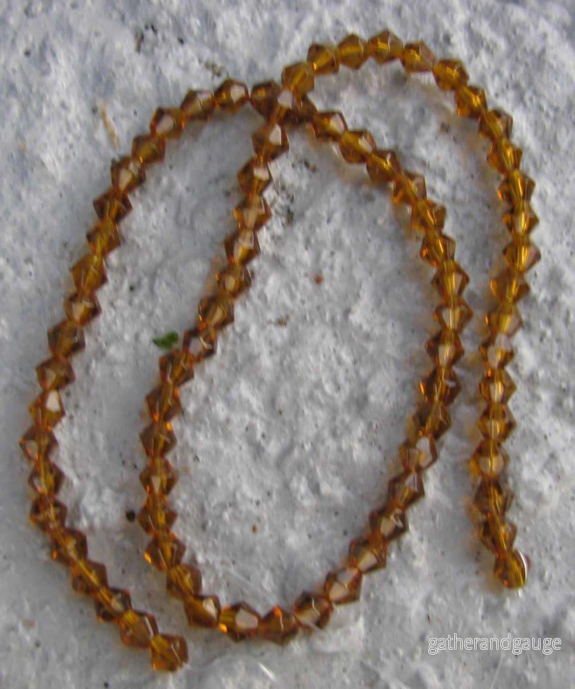 Glaspärlor Bicone - Brun, 4 mm, 1 sträng - Bild 2