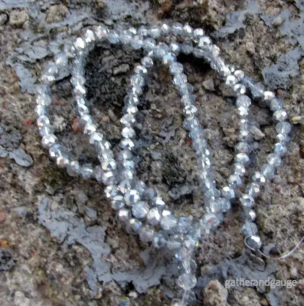 Facetterade glaspärlor - Klar/Silver, 4x3mm, 1 sträng