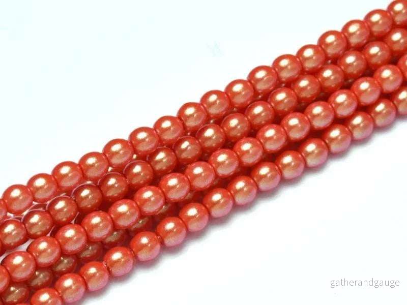 Tjeckiska Pearl Shell – Light Siam 2mm, 1 sträng Tjeckiska Pearl Shell – Light Siam 2mm, 1 sträng