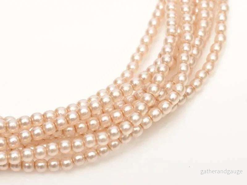 Tjeckiska vaxade glaspärlor - Shiny Peach Chiffon 2mm, 1 sträng