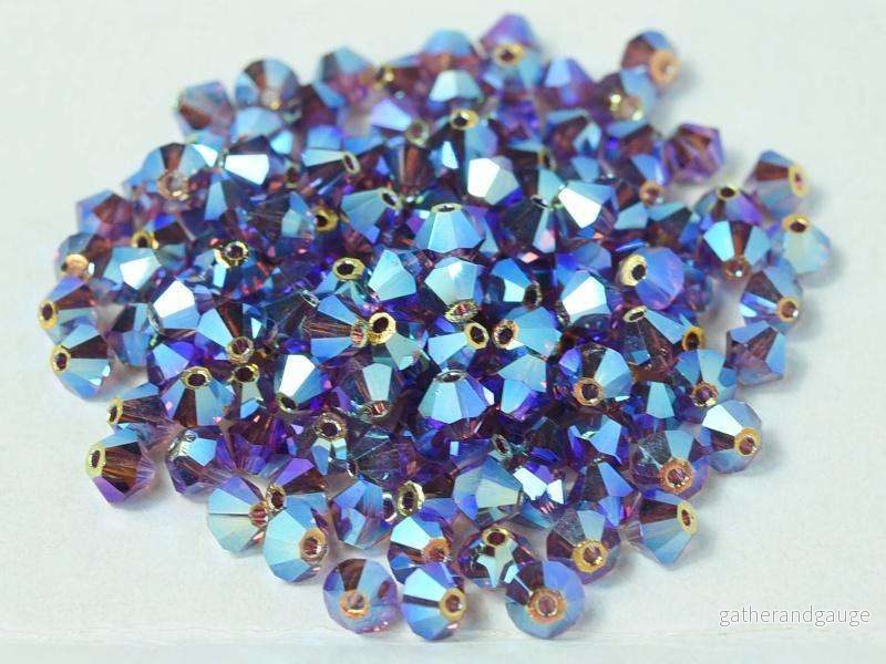 Tjeckiska Bicone - Amethyst 2x AB 4 mm, 24-pack