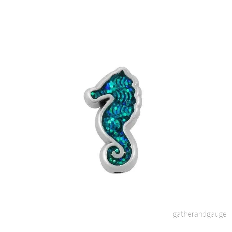 Slider silverpläterad – Sjöhäst med glitter turkos AB 8x15mm 1 styck Slider silverpläterad – Sjöhäst med glitter turkos AB 8x15mm 1 styck