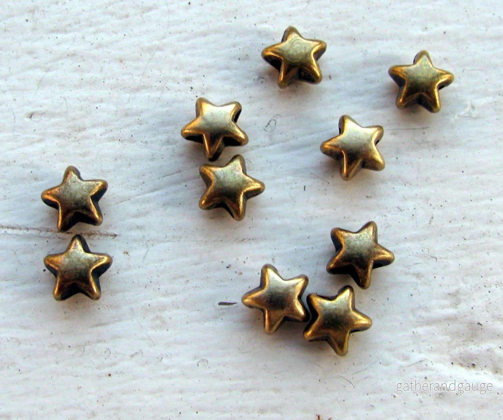 Mellandel bronsfärgad – Liten stjärna, 6mm, 10-pack