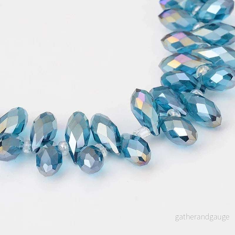 Facetterade droppar – Stålblå med lyster, 13x6mm, 1 styck Facetterade droppar – Stålblå med lyster, 13x6mm, 1 styck