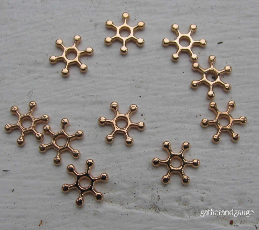 Mellandel roséguldfärgad - Snöflinga 8 mm, 10-pack