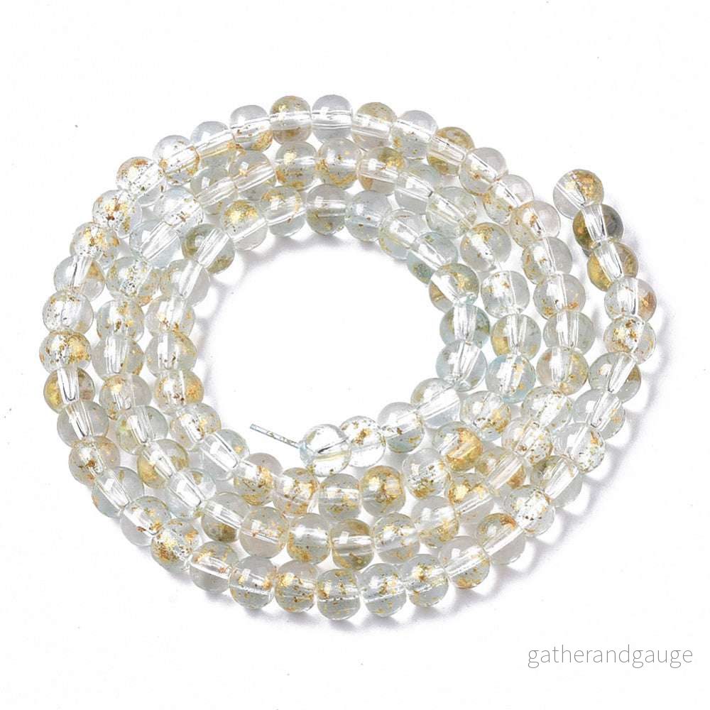 Glaspärlor Rund – Klar med Guldshimmer 4mm 1 sträng Glaspärlor Rund – Klar med Guldshimmer 4mm 1 sträng