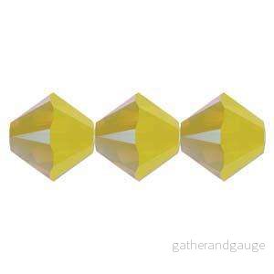 Swarovski Crystals Bicone (5328) – Yellow Opal Shimmer 4mm, 10-pack Swarovski Crystals Bicone (5328) – Yellow Opal Shimmer 4mm, 10-pack
