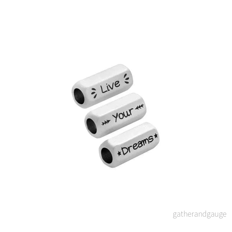 Mellandel Silverfärgad – Tub med text ”Live, Your, Dreams” 8x19mm 1 styck Mellandel Silverfärgad – Tub med text ”Live, Your, Dreams” 8x19mm 1 styck