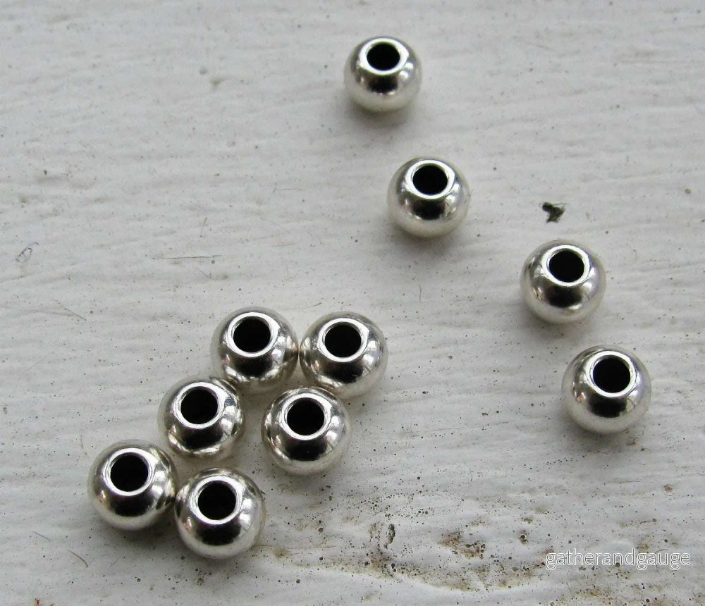 Mellandel silverfärgad – Rund med större hål 6x4mm 10-pack