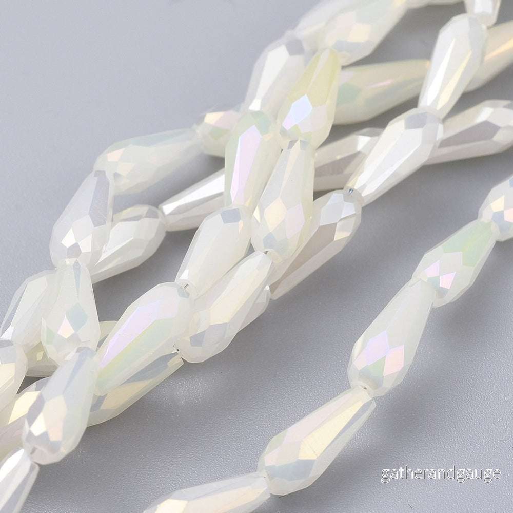 Facetterade droppar – Teardrop Svagt gul Rainbow, 10x4mm, 1 styck Facetterade droppar – Teardrop Svagt gul Rainbow, 10x4mm, 1 styck